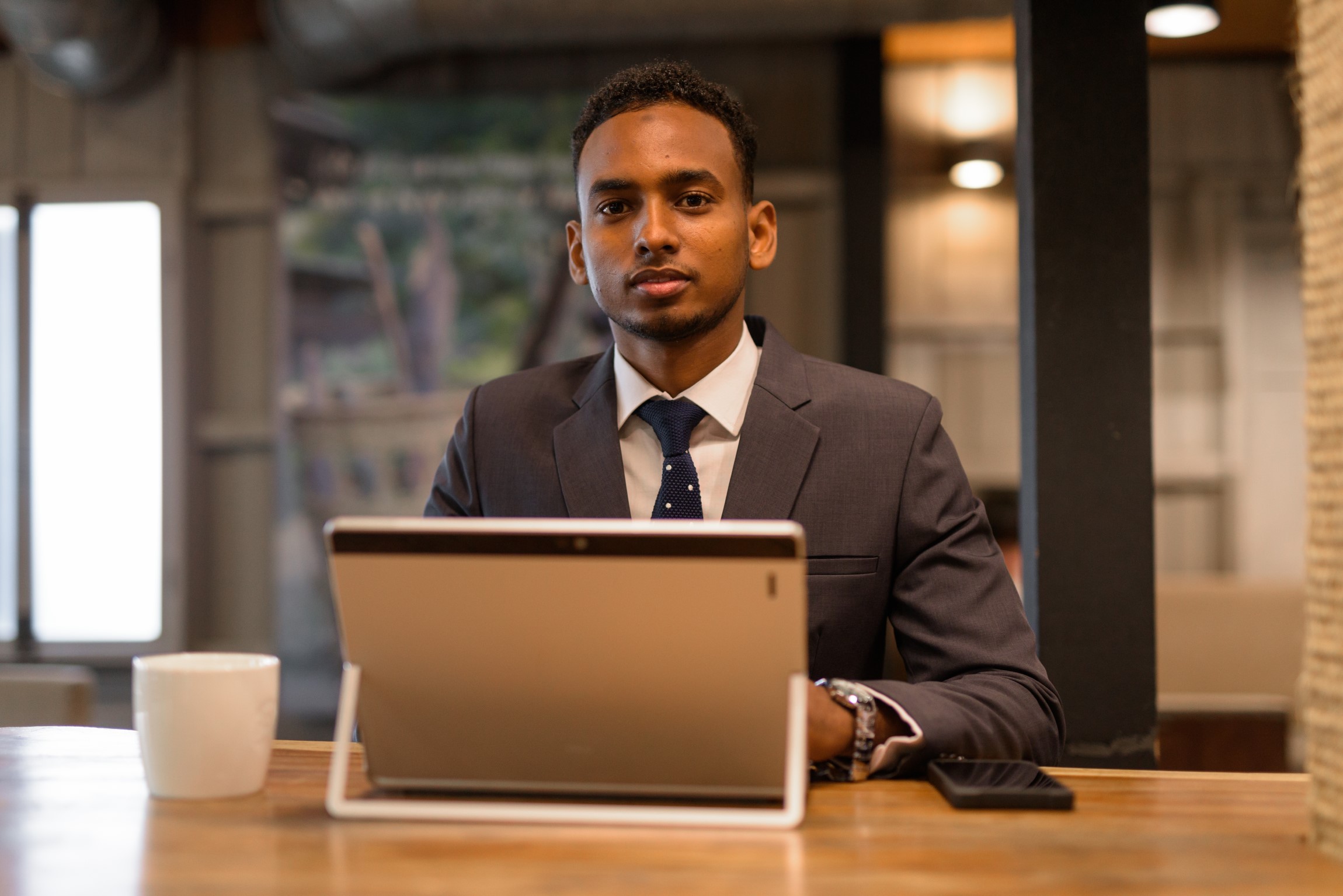 young-african-businessman-using-laptop-computer-at-2021-08-29-17-47-17-utc.jpg