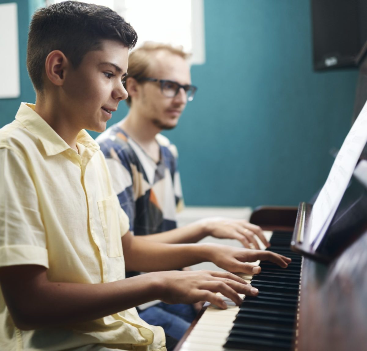 smiling-boy-playing-the-piano-with-his-teacher-2021-09-24-04-29-00-utc.jpg smiling-boy-playing-the-piano-with-his-teacher-2021-09-24-04-29-00-utc.jpg