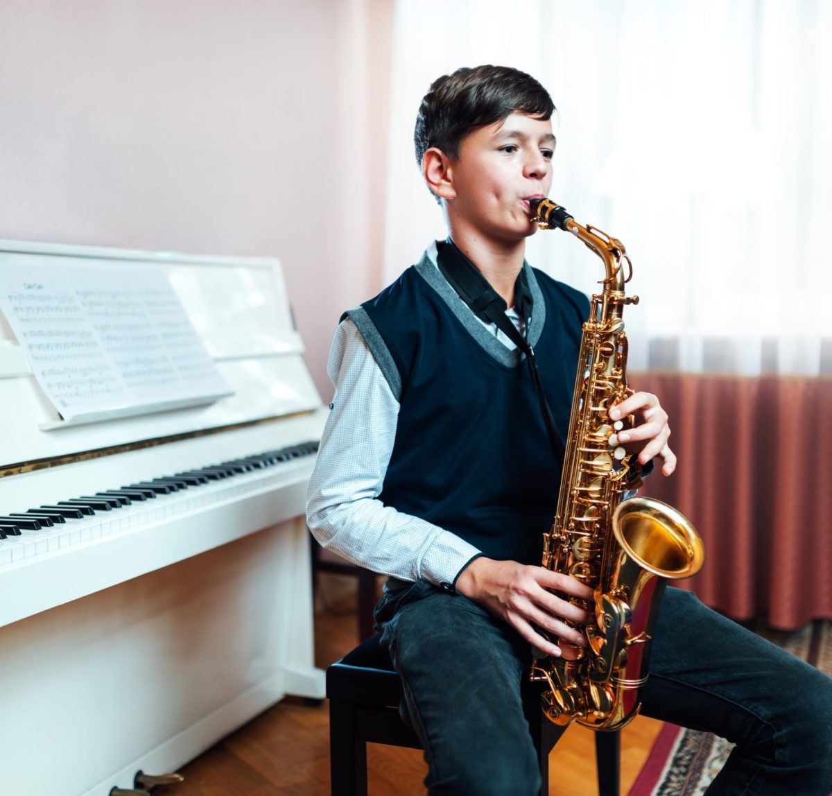 student-boy-plays-saxophone-while-sitting-at-a-mus-2021-08-27-09-32-46-utc.jpg student-boy-plays-saxophone-while-sitting-at-a-mus-2021-08-27-09-32-46-utc.jpg