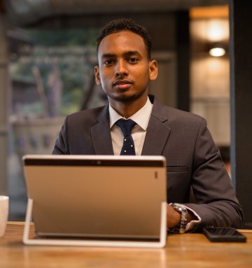 young-african-businessman-using-laptop-computer-at-2021-08-29-17-47-17-utc.jpg
